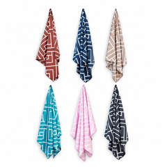 Six Newlyfe waffle-weave bath towels in Rust, Navy, Sandstone, Teal, Pink and Slate