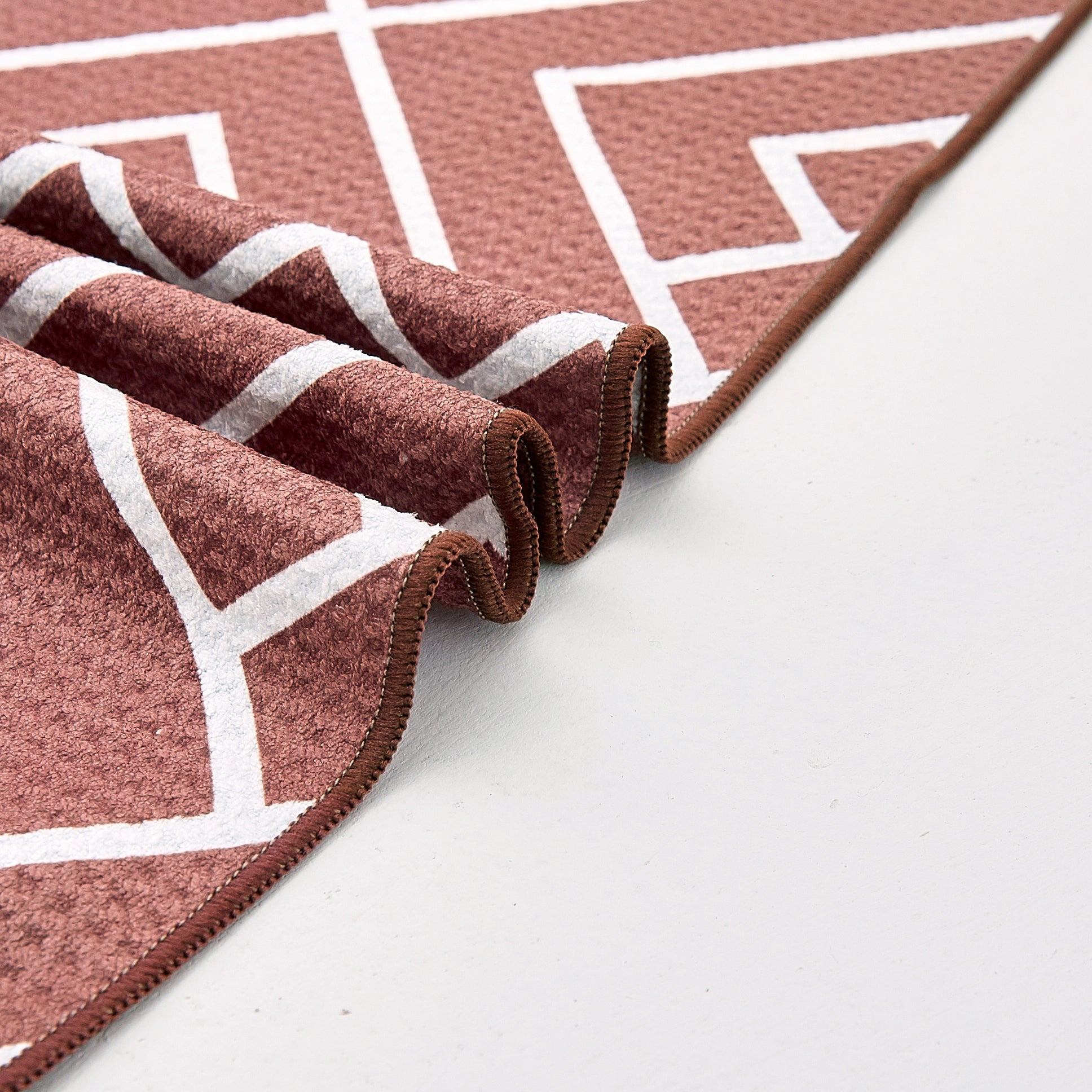 Close-up of rust waffle-weave microfibre bath towel
