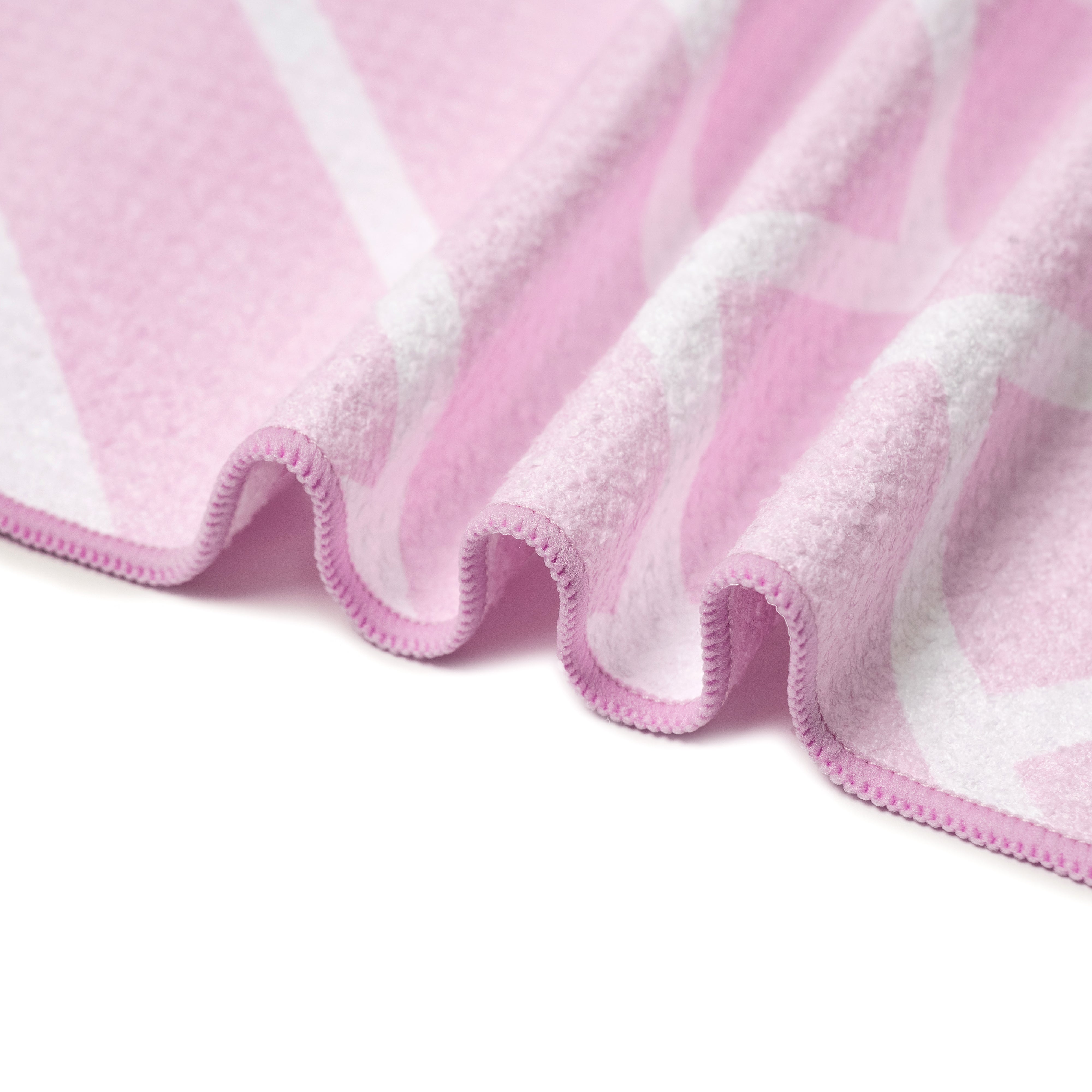 Close-up of pink waffle-weave microfibre bath towel