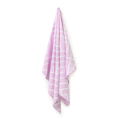 Pink Newlyfe waffle-weave bath towel hanging